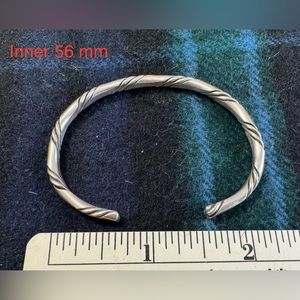 Adjustable solid sterling silver twist women’s bangle bracelet.  Hand made.